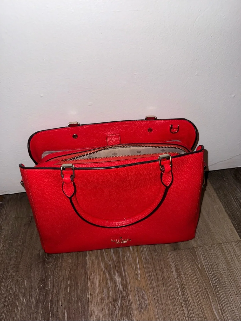 kate spade red pebbled leather satchel with polished hardware